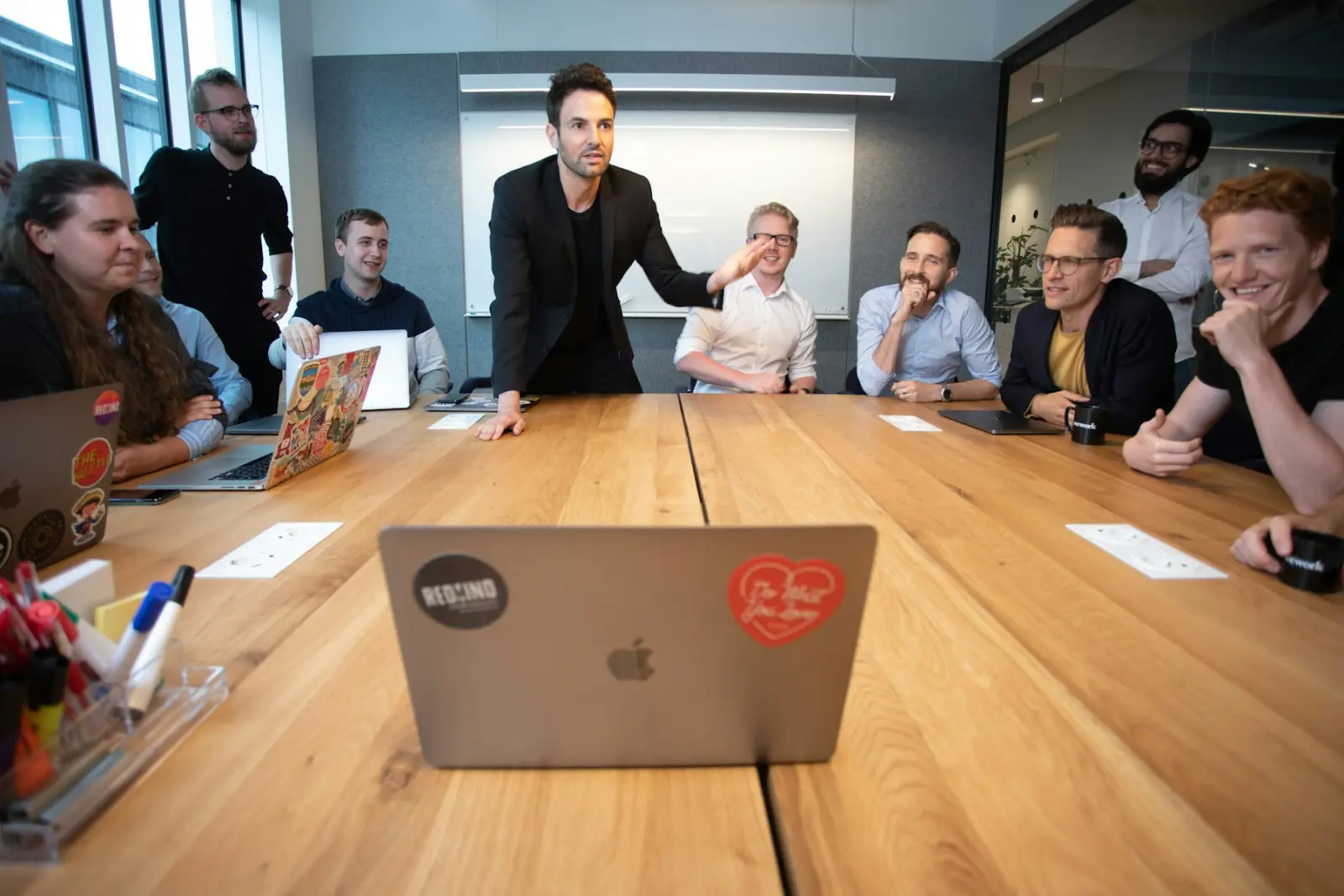 A team gathered around a large table during a collaborative session